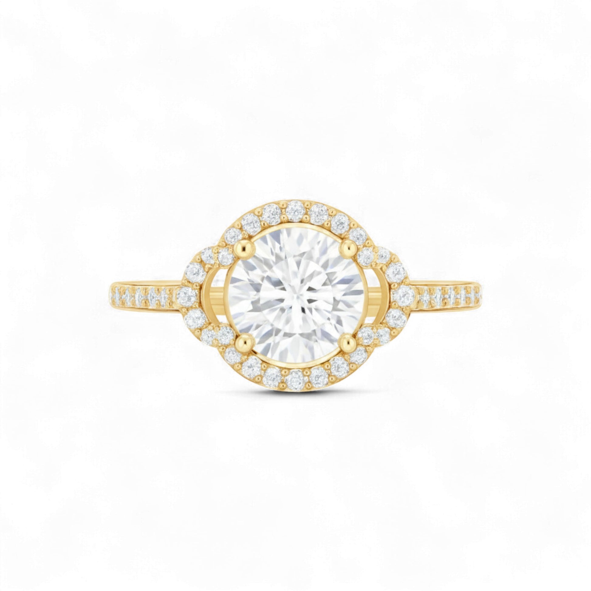 Gold ring with a large diamond and smaller diamonds on the band against a white background