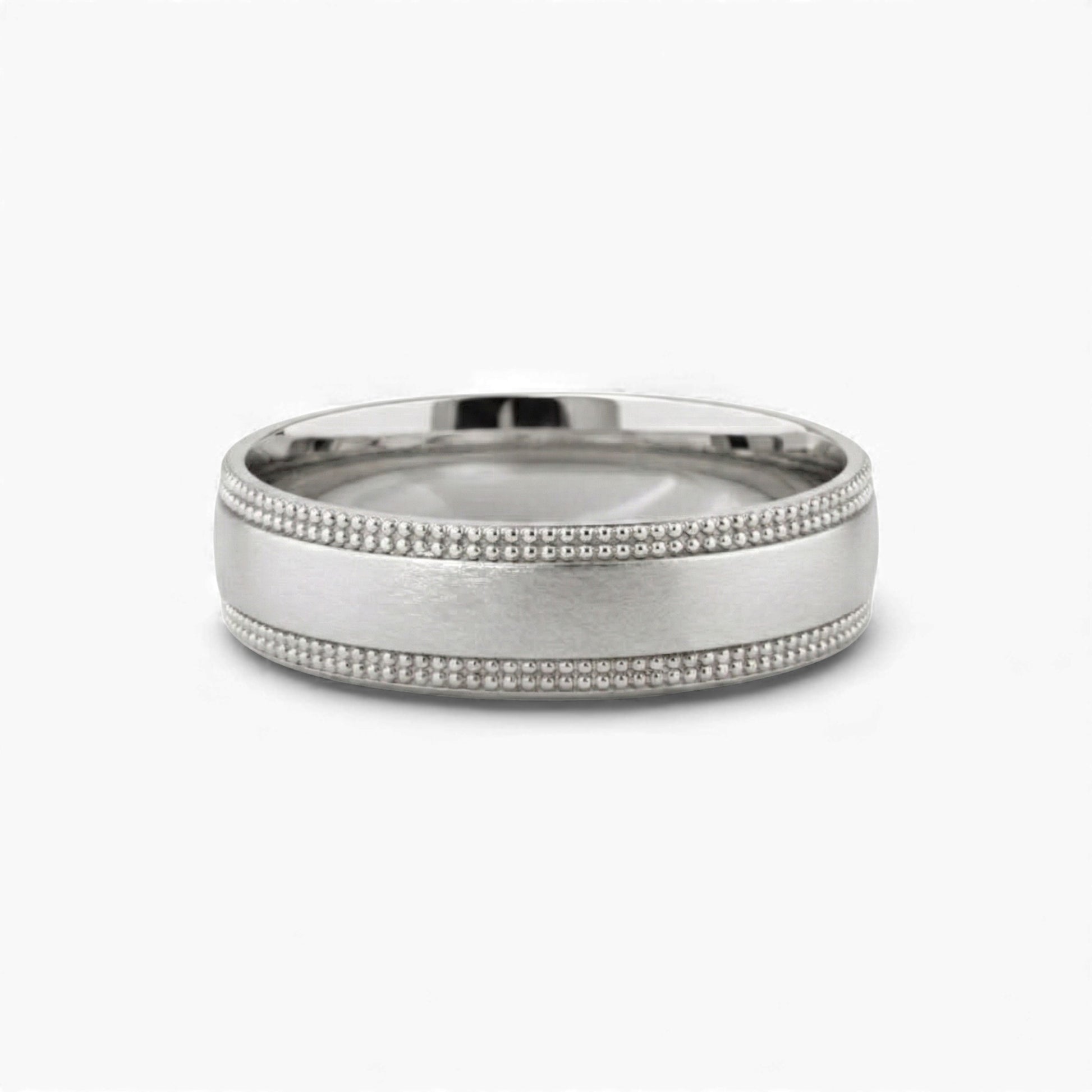 Silver ring with beaded design on a white background