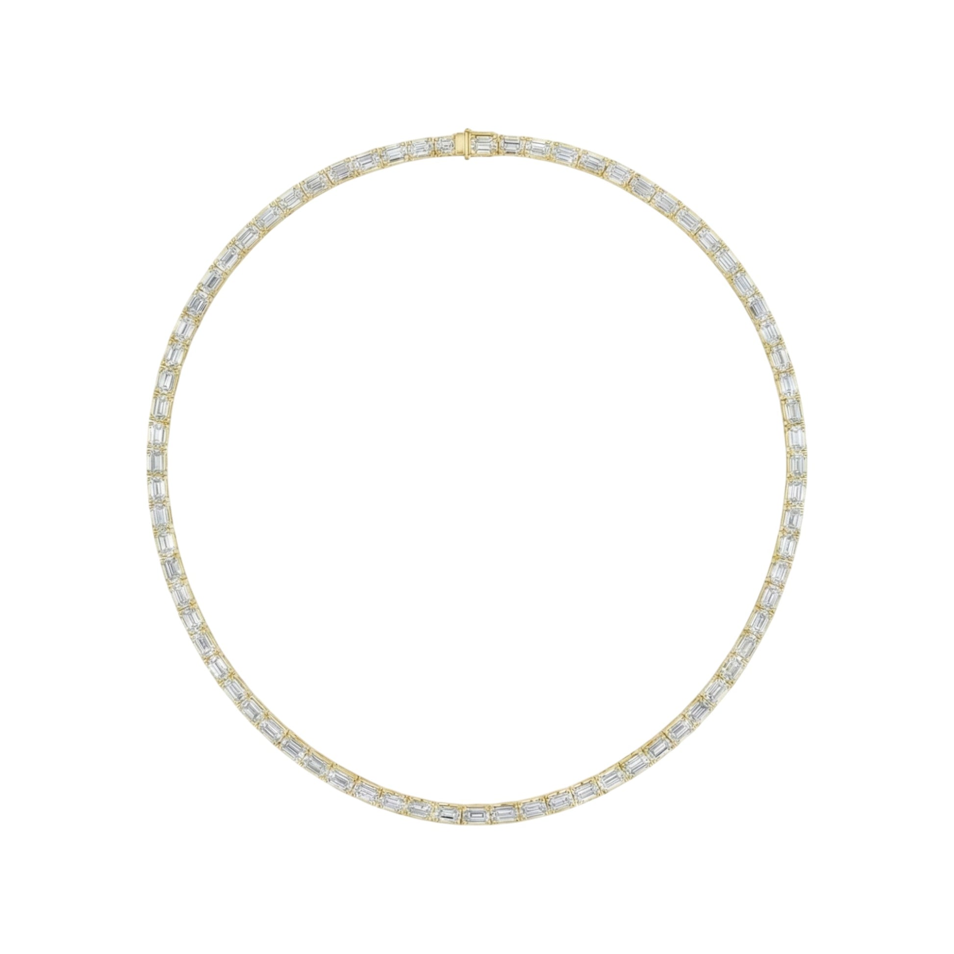 Gold necklace with clear stones on a white background
