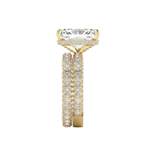 Gold ring with a large central gemstone and smaller stones on a white background