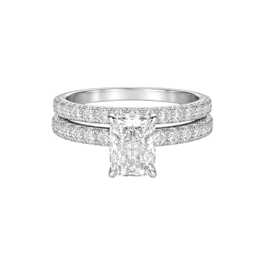 Diamond ring with a central gemstone on a white background