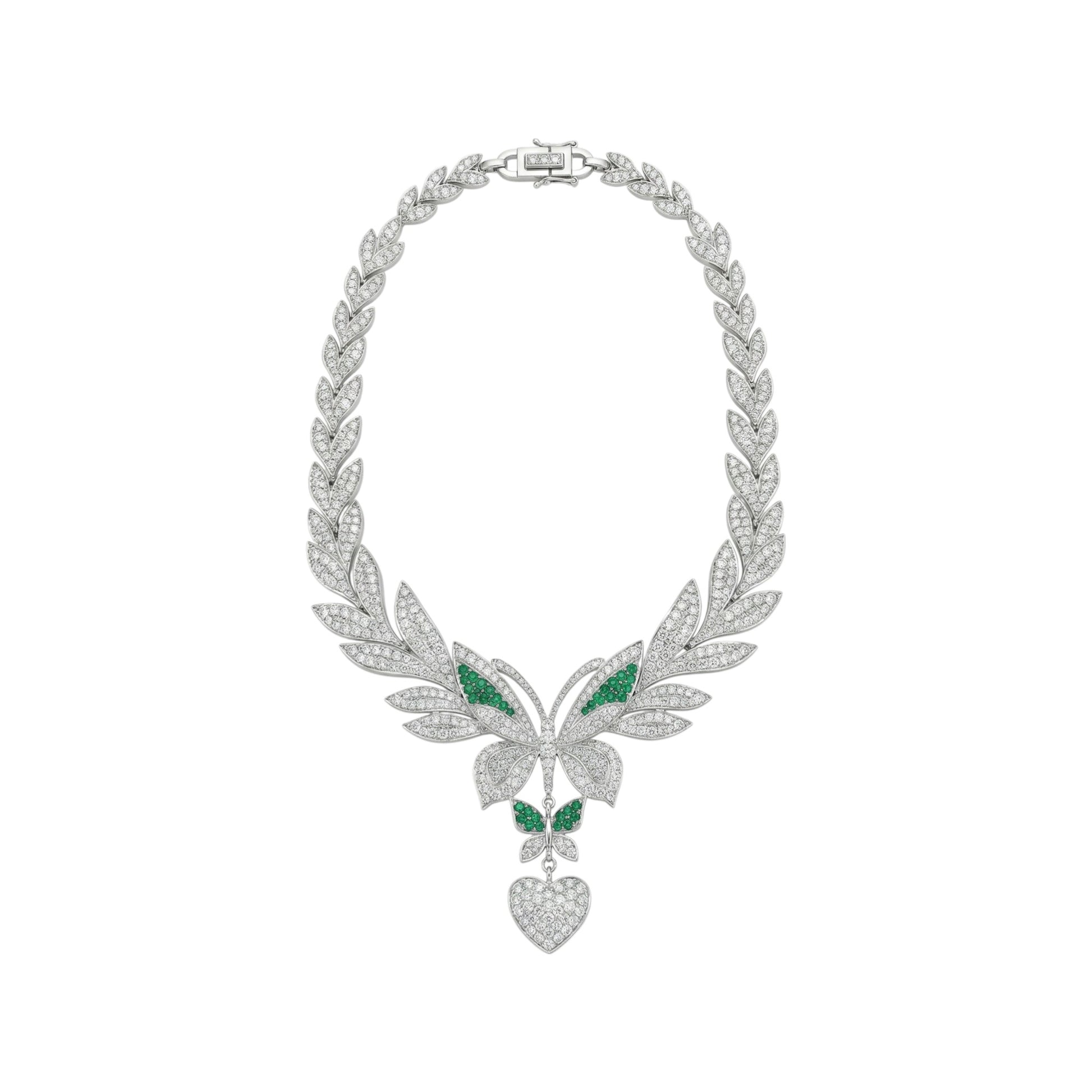 Ornate silver necklace with green gemstones on a white background