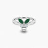 Silver ring with green gemstones and heart design on a white background
