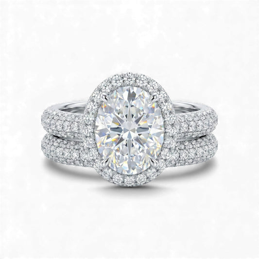 Diamond ring with a large central gemstone and smaller stones on a white background