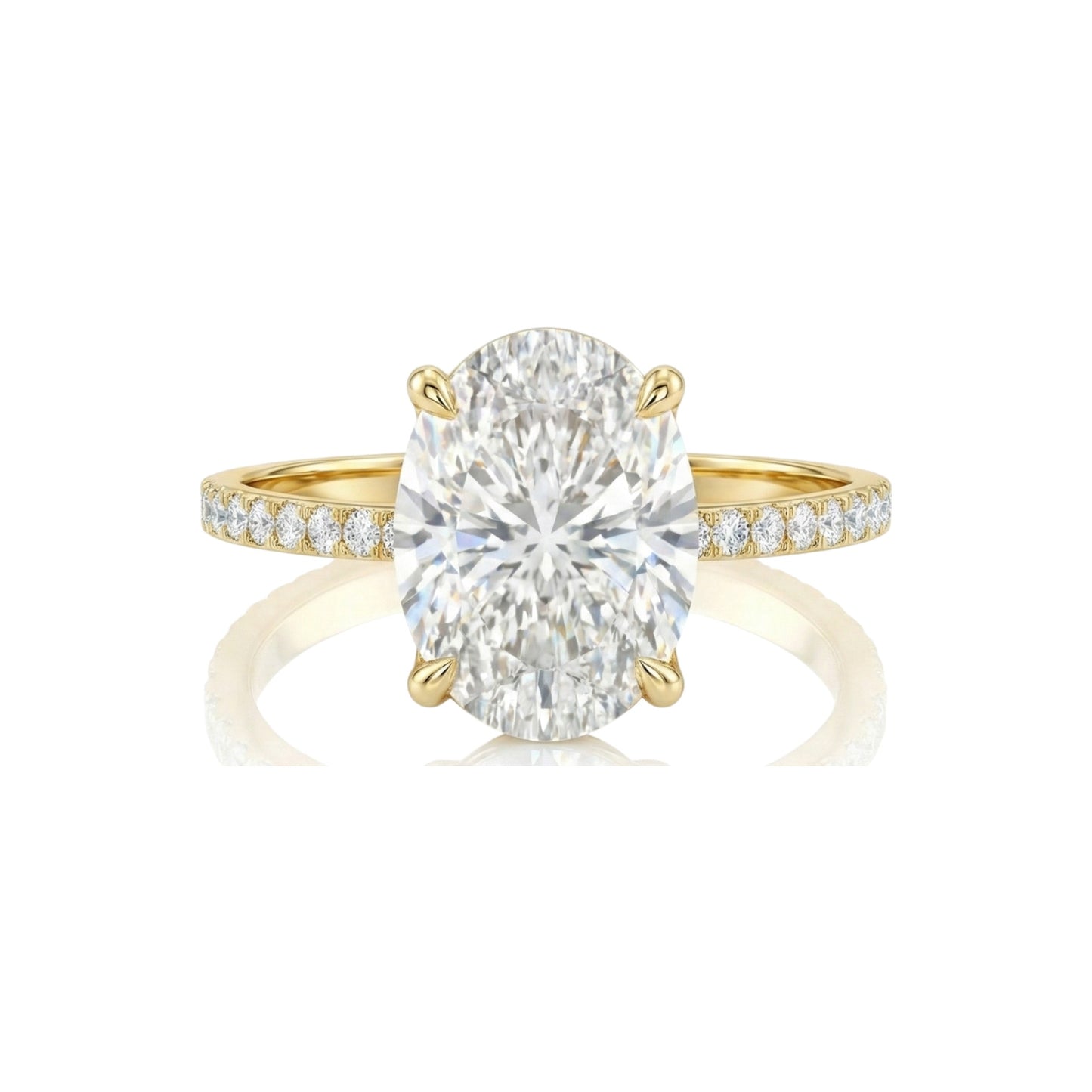 Gold ring with a large diamond and smaller diamonds on the band against a white background
