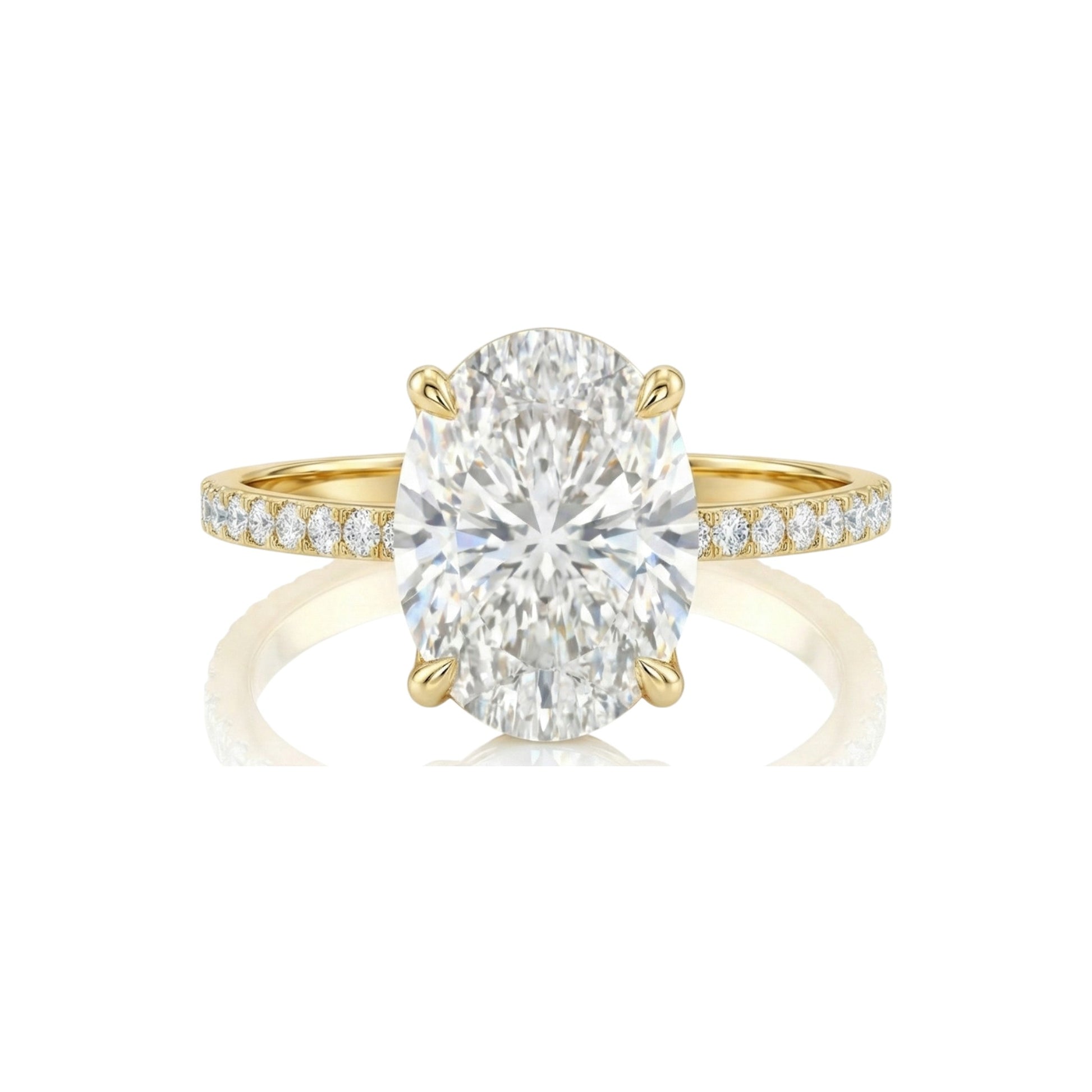 Gold ring with a large diamond and smaller diamonds on the band against a white background