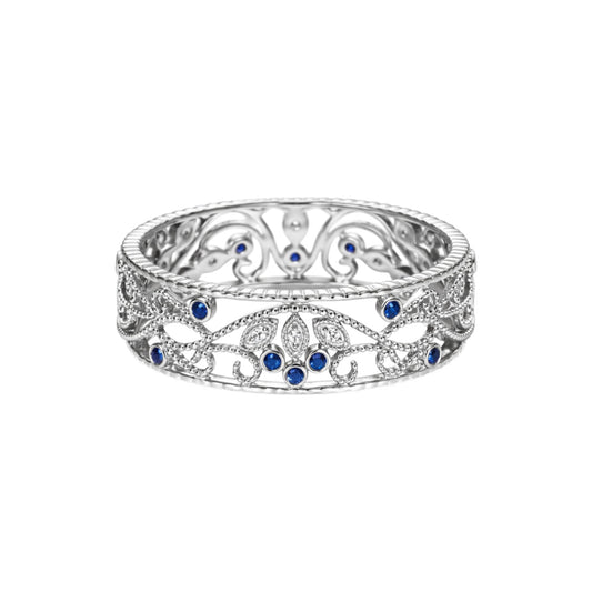 Silver ring with blue gemstones on a white background