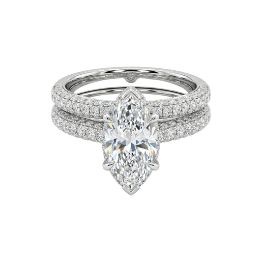 Diamond ring with a pear-shaped center stone on a white background