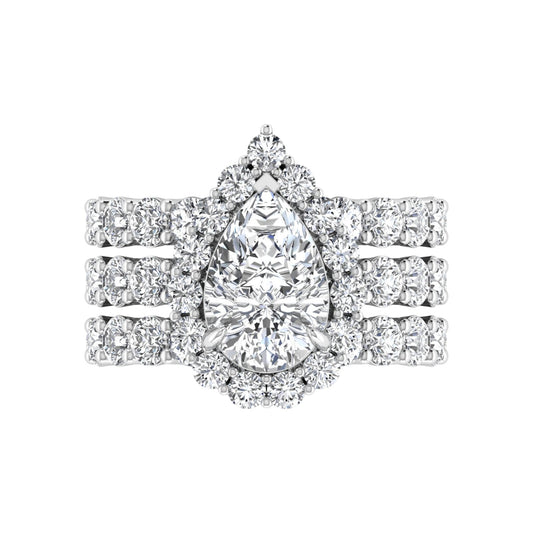 Diamond ring with a pear-shaped center stone on a white background