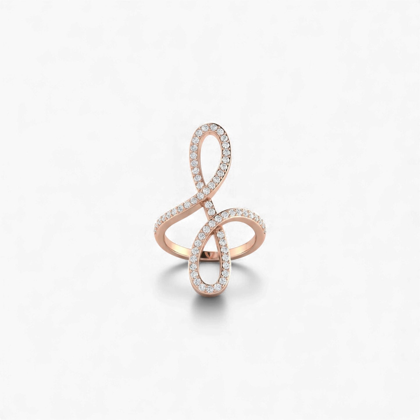 Rose gold ring with diamond accents on a light gray background