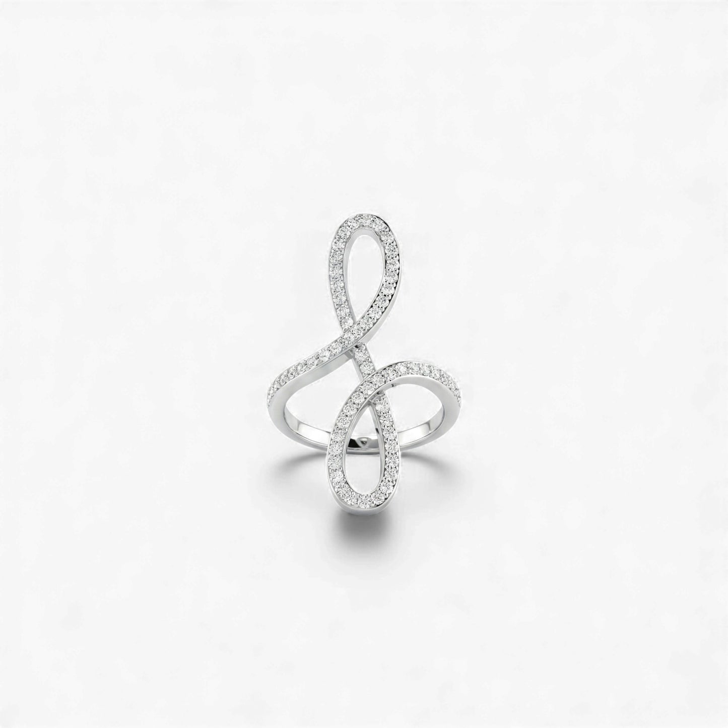 Silver ring designed like a music note on a white background