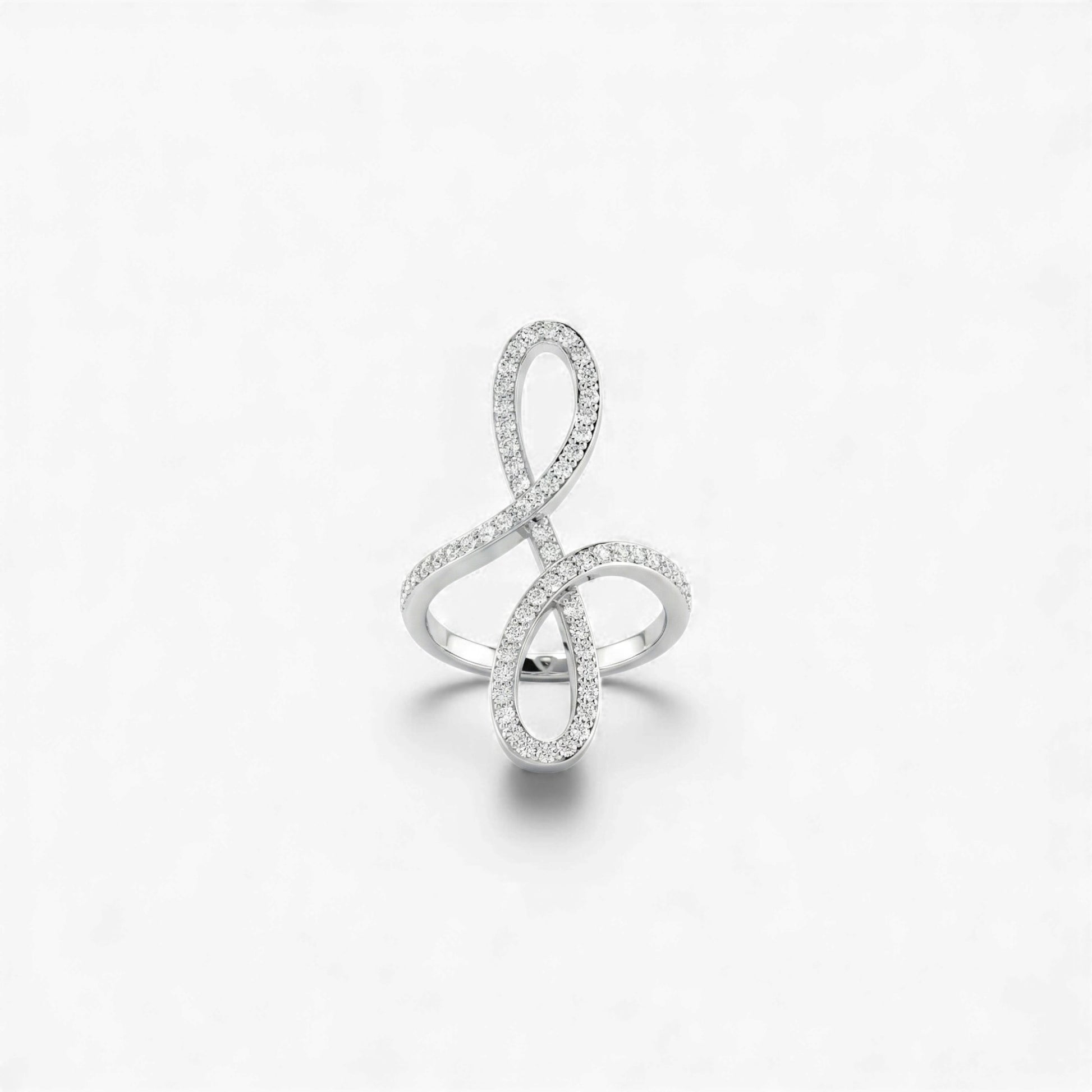 Silver ring designed like a music note on a white background