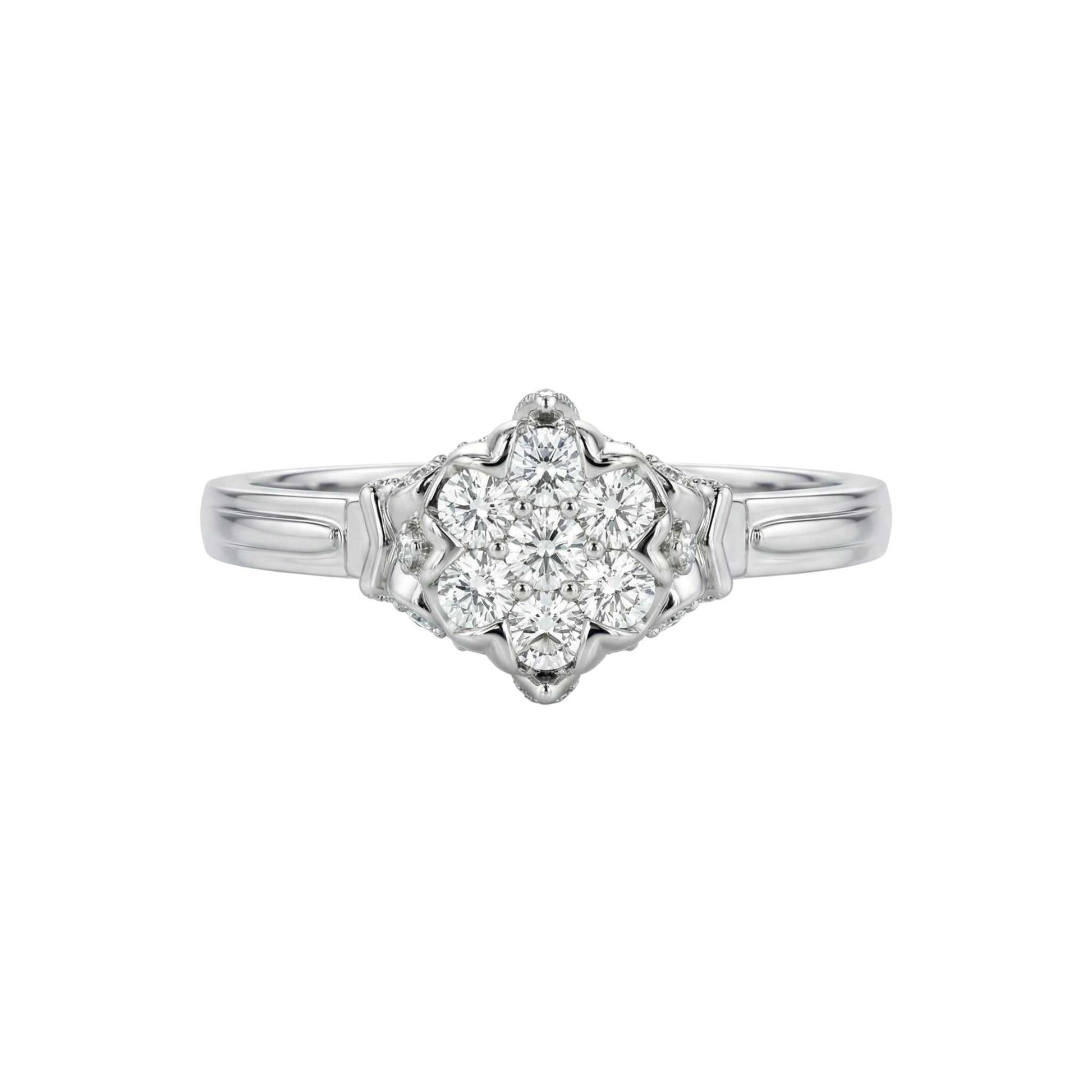 Silver ring with a diamond heart-shaped center on a white background