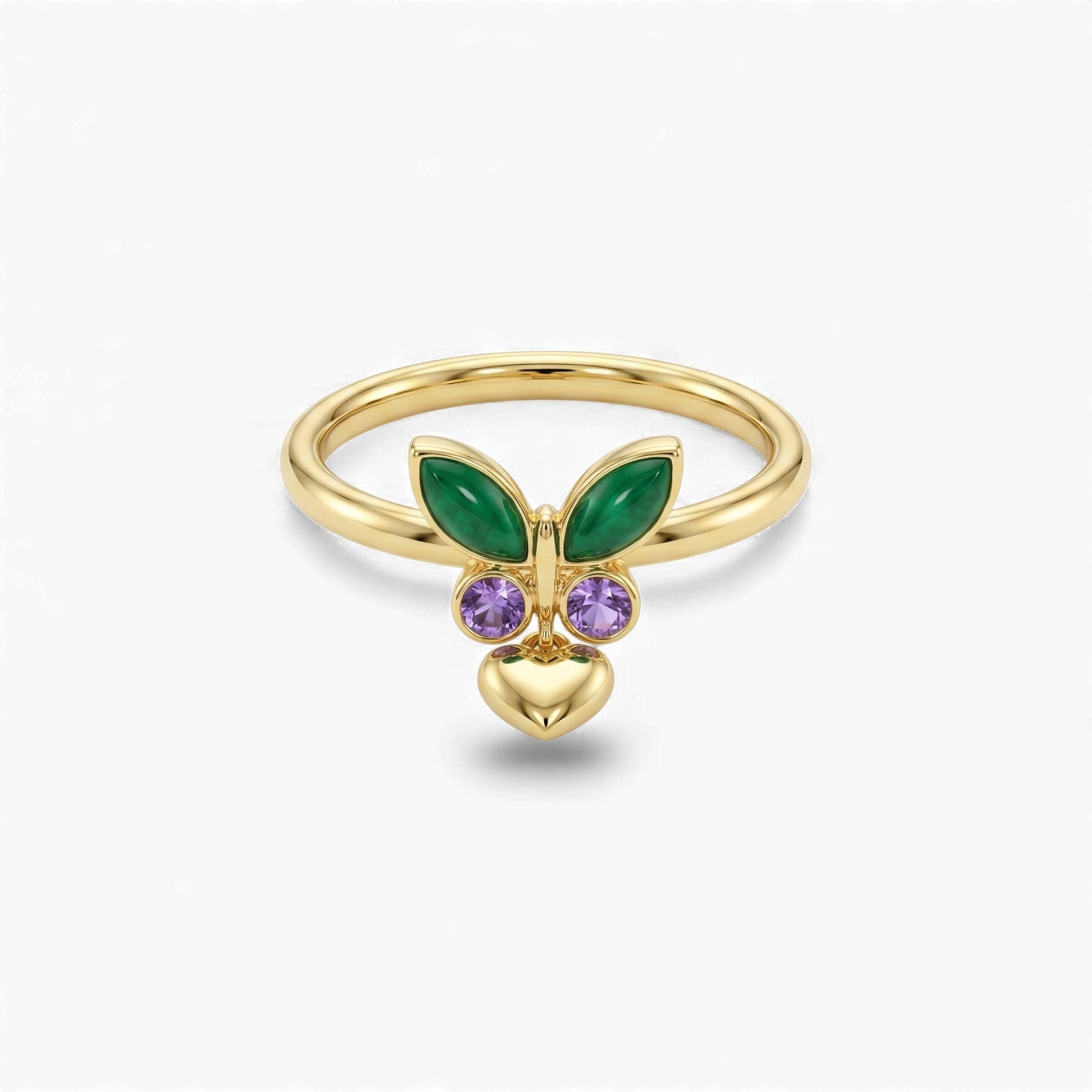 Gold ring with green and purple gemstones on a white background