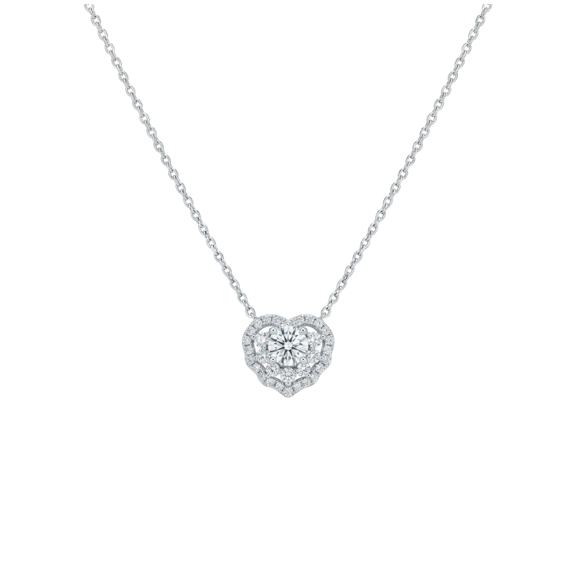 Heart-shaped diamond necklace on a white background