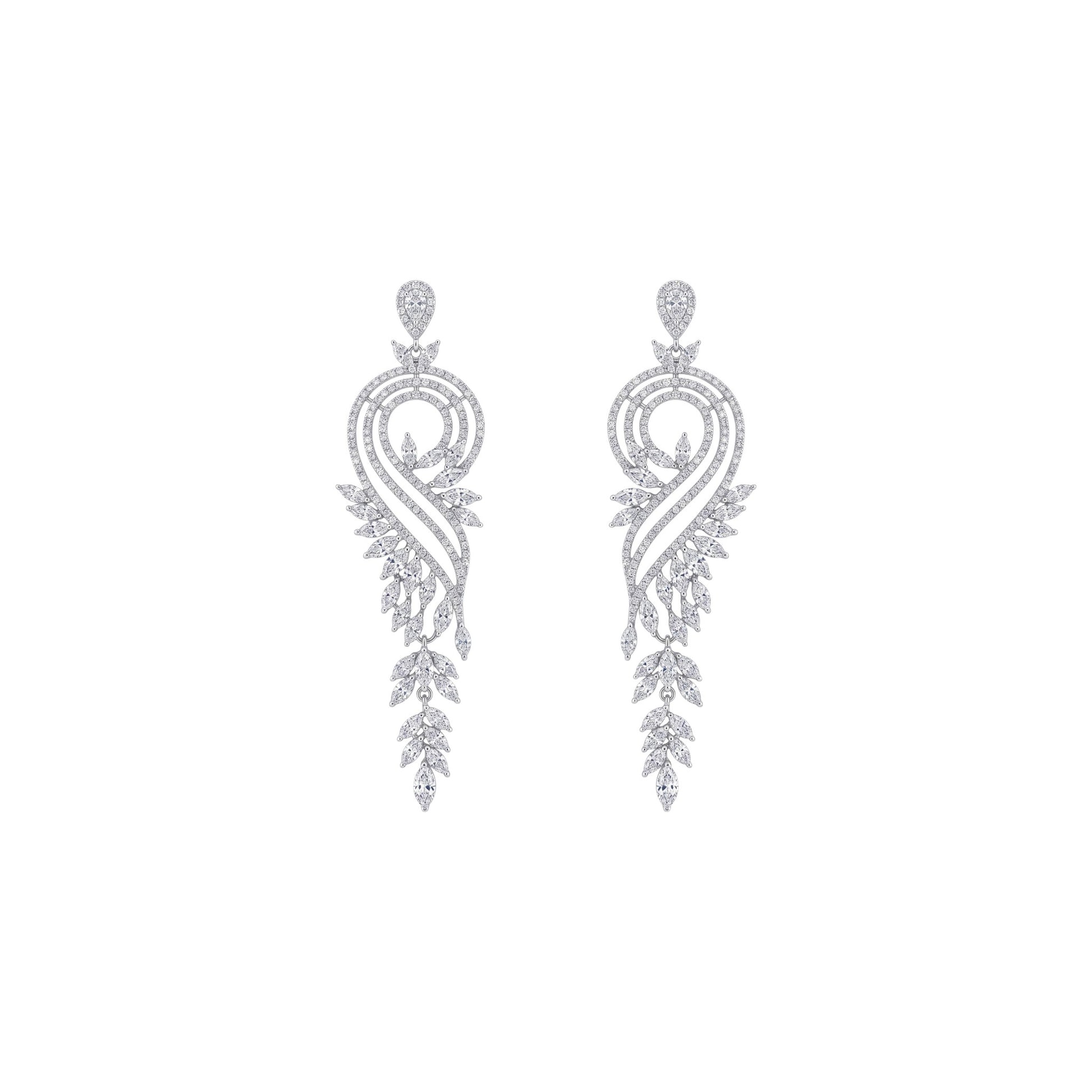 Pair of silver earrings with intricate designs on a white background