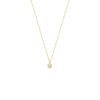 Gold necklace with a small round pendant on a white background