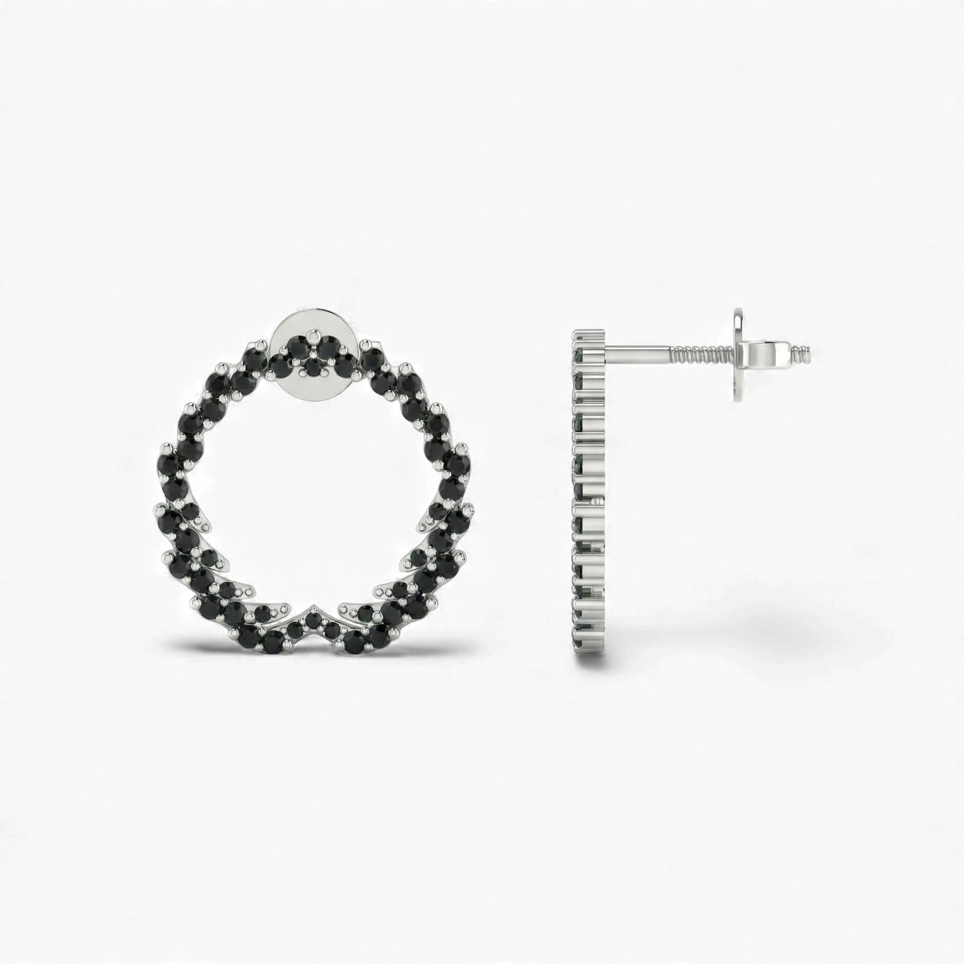 Hoop earrings with black gemstones on a white background