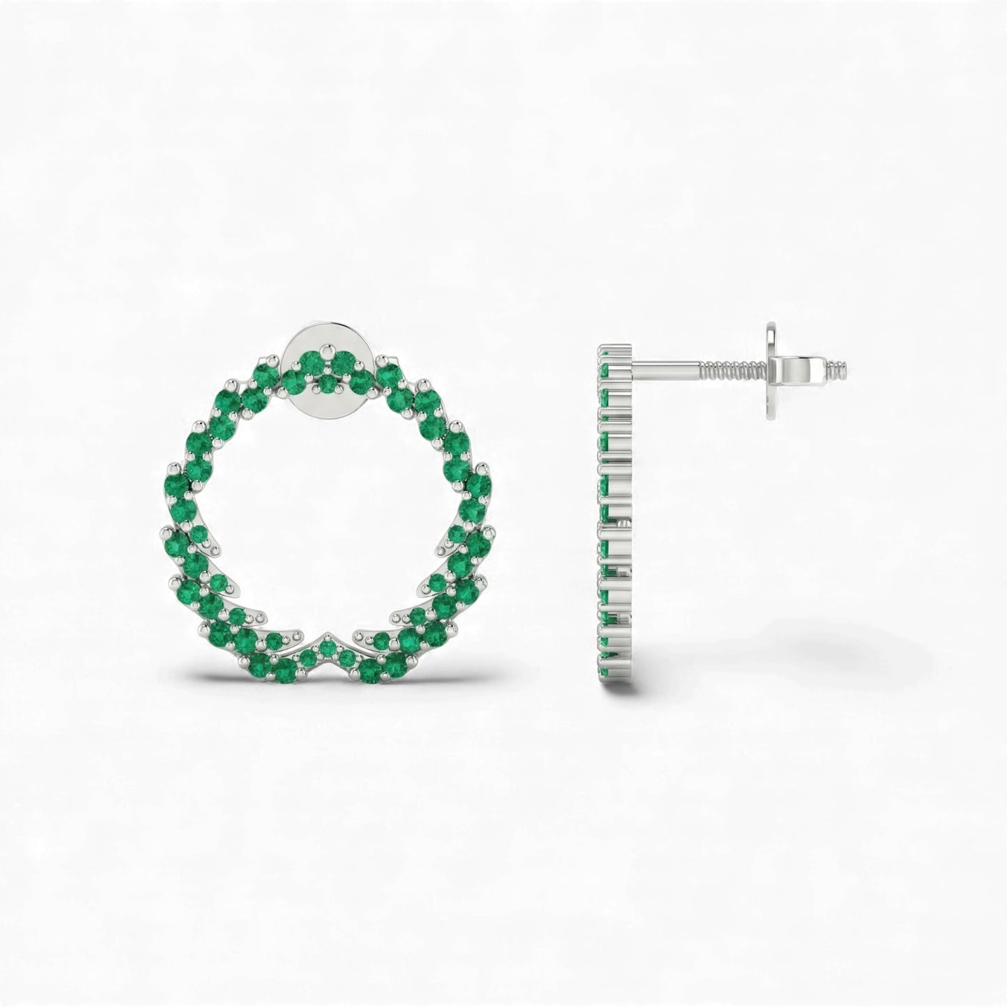 Hoop earrings with green gemstones on a white background