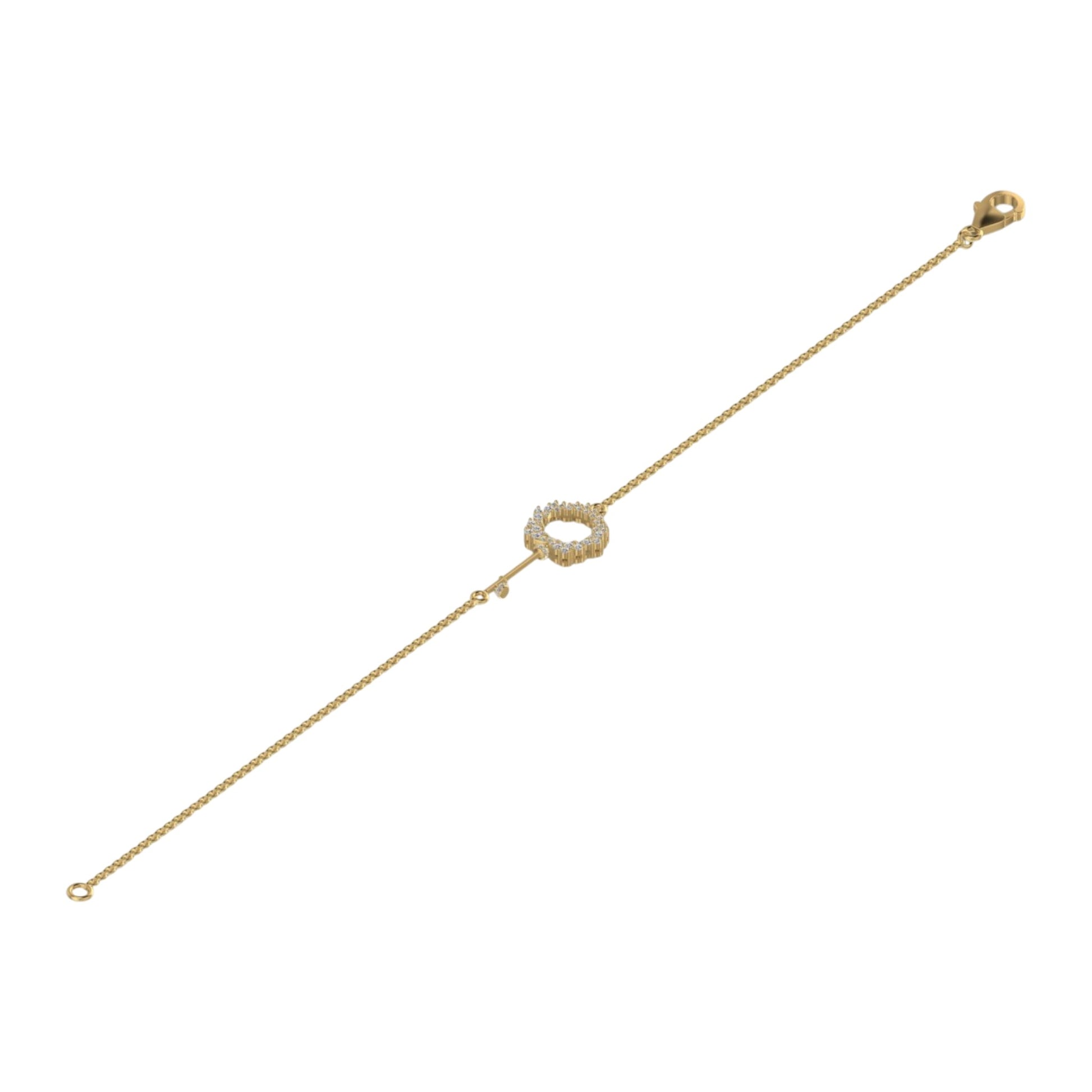 Gold bracelet with a small circular clasp on a white background