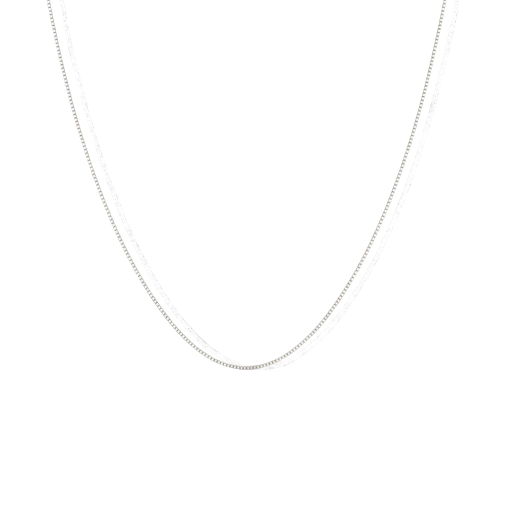 Silver chain necklace on a white background