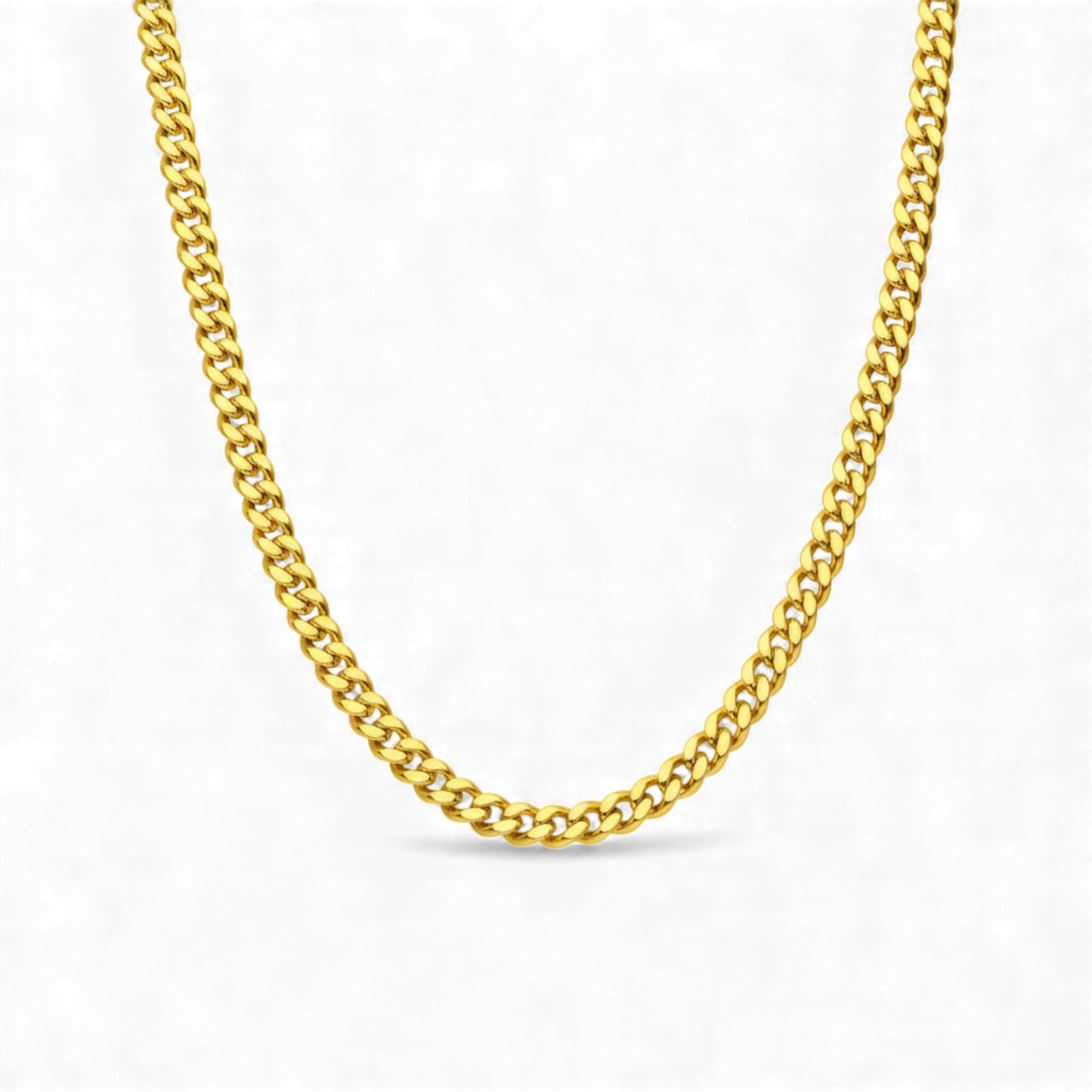 Gold chain necklace on a white background
