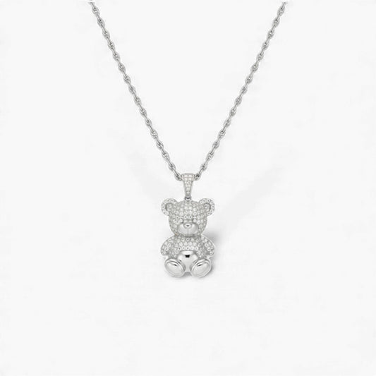 Silver teddy bear pendant necklace on a white background
