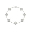 Silver bracelet with clover-shaped charms on a white background