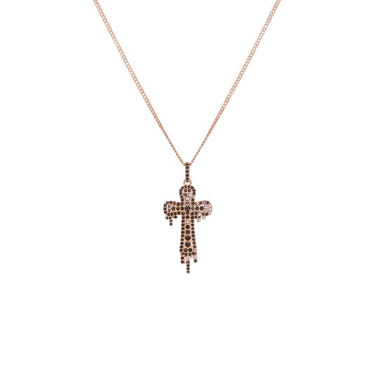 Rose gold cross necklace with small stones on a white background