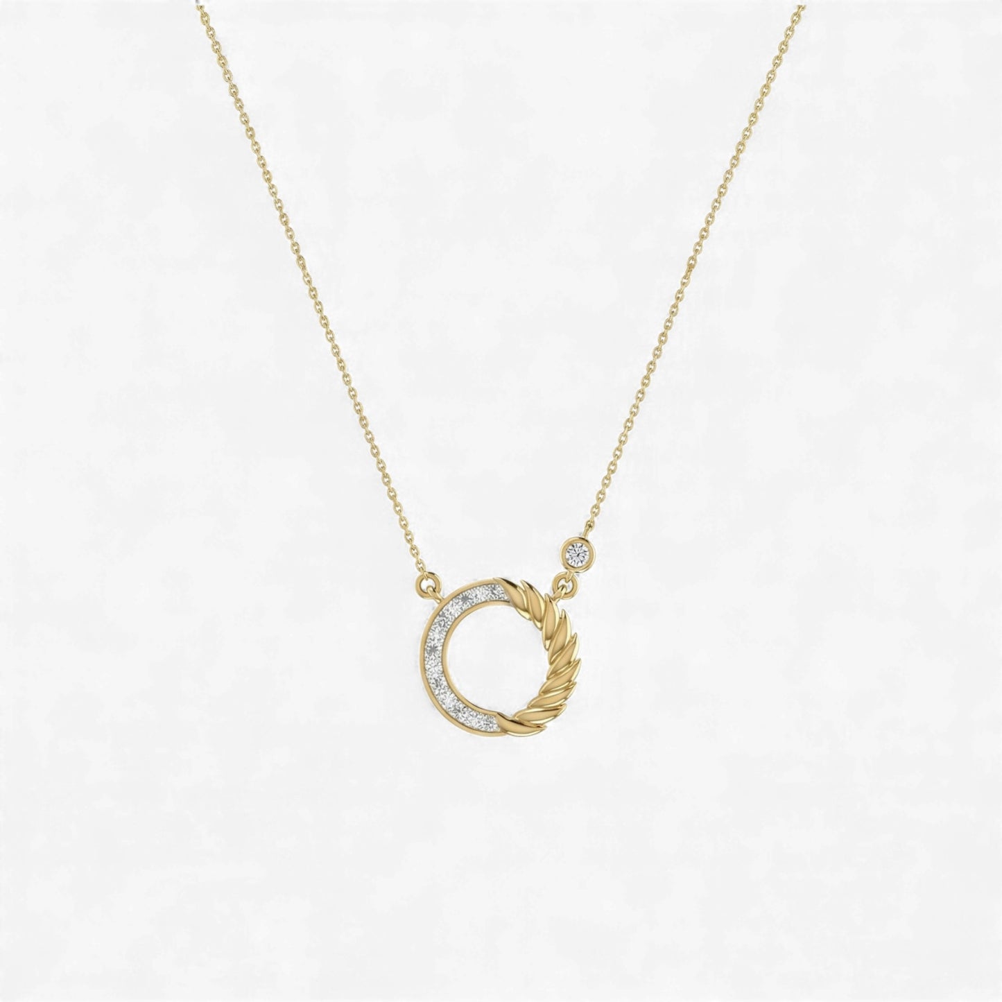 Gold necklace with a unique pendant on a light gray background