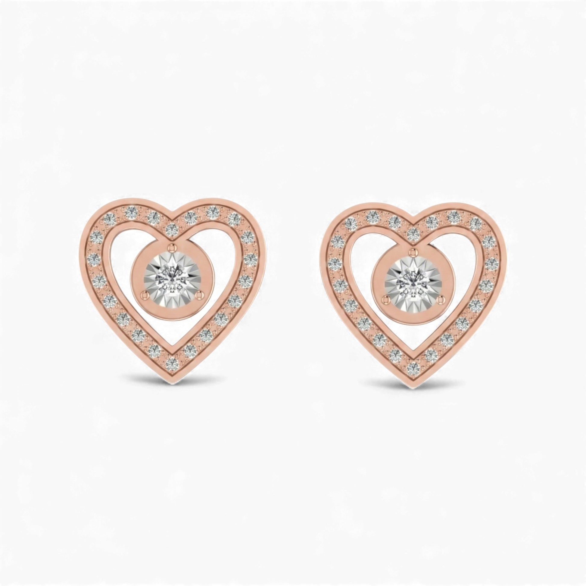 Rose gold heart-shaped earrings with clear gemstones on a white background