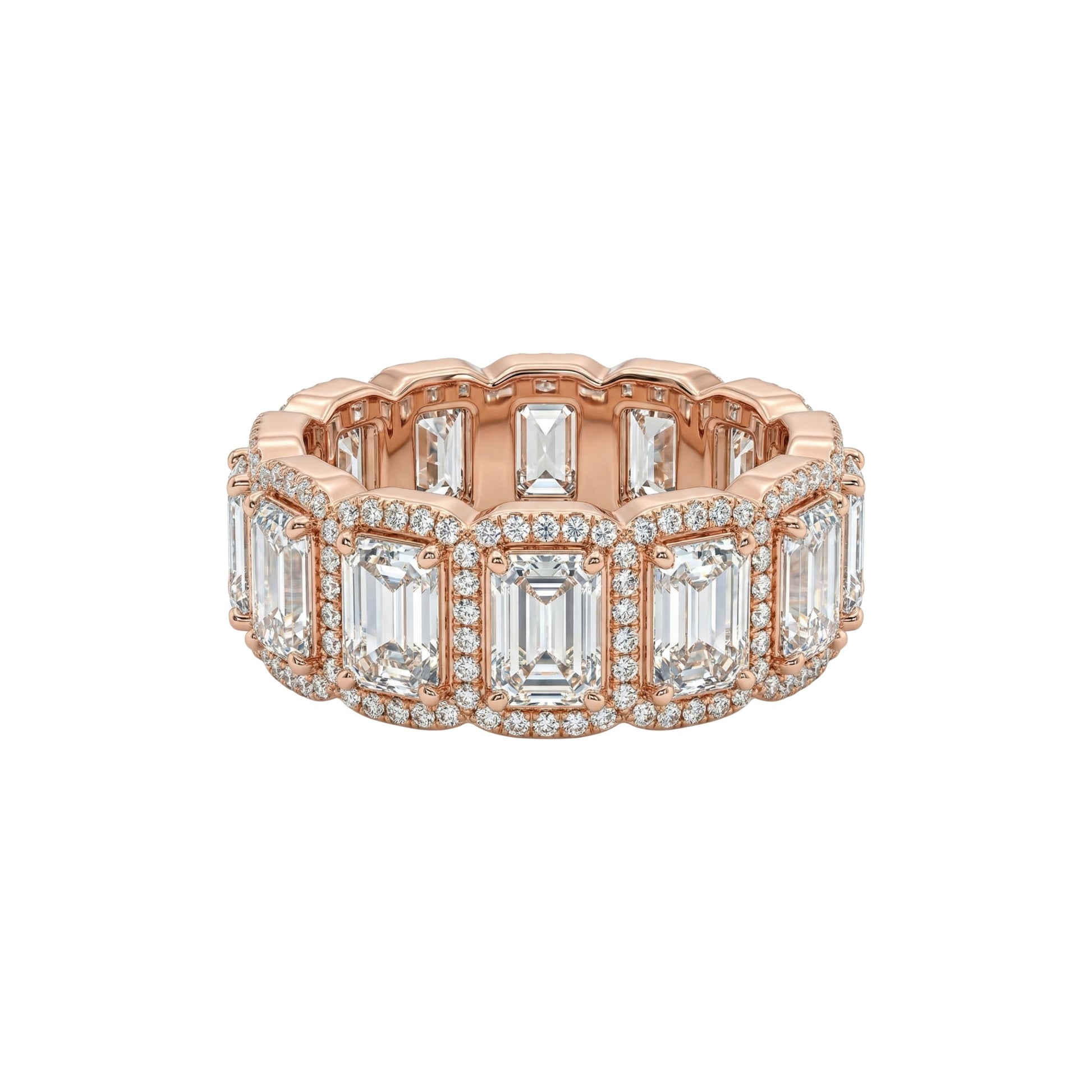 Rose gold ring with emerald-cut diamonds on a white background