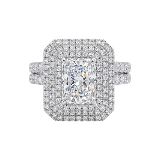 Diamond ring with a large central gemstone and smaller diamonds around on a white background
