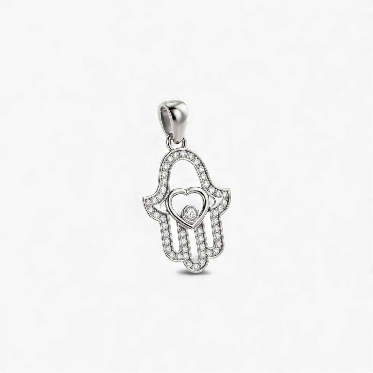 Silver pendant shaped like a hand with a heart in the center on a white background