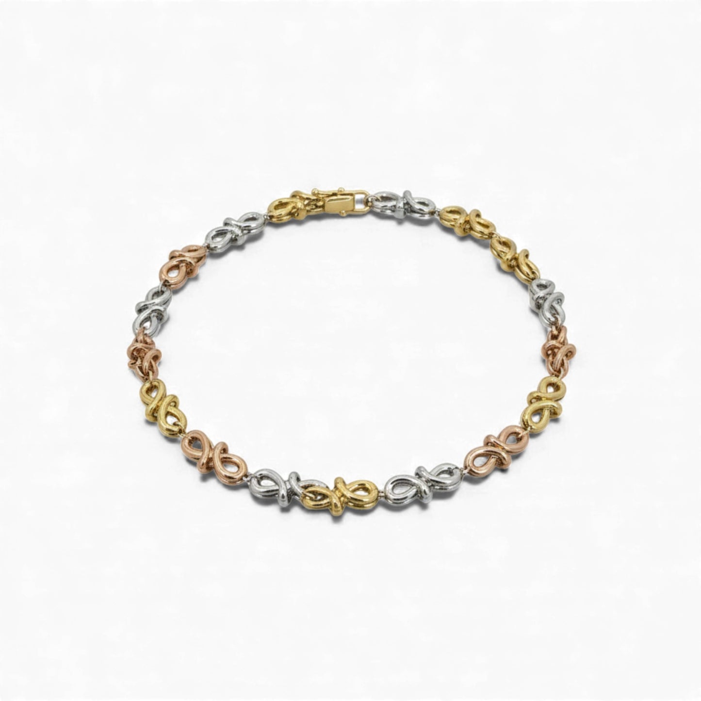 Tri-color bracelet with floral designs on a white background