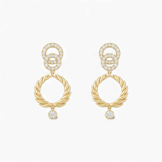 Gold earrings with interlocking rings and small diamonds on a white background
