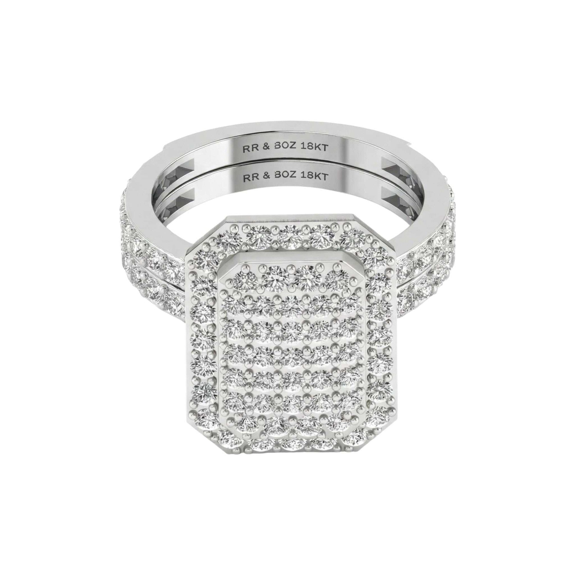 Silver ring with diamond accents on a white background