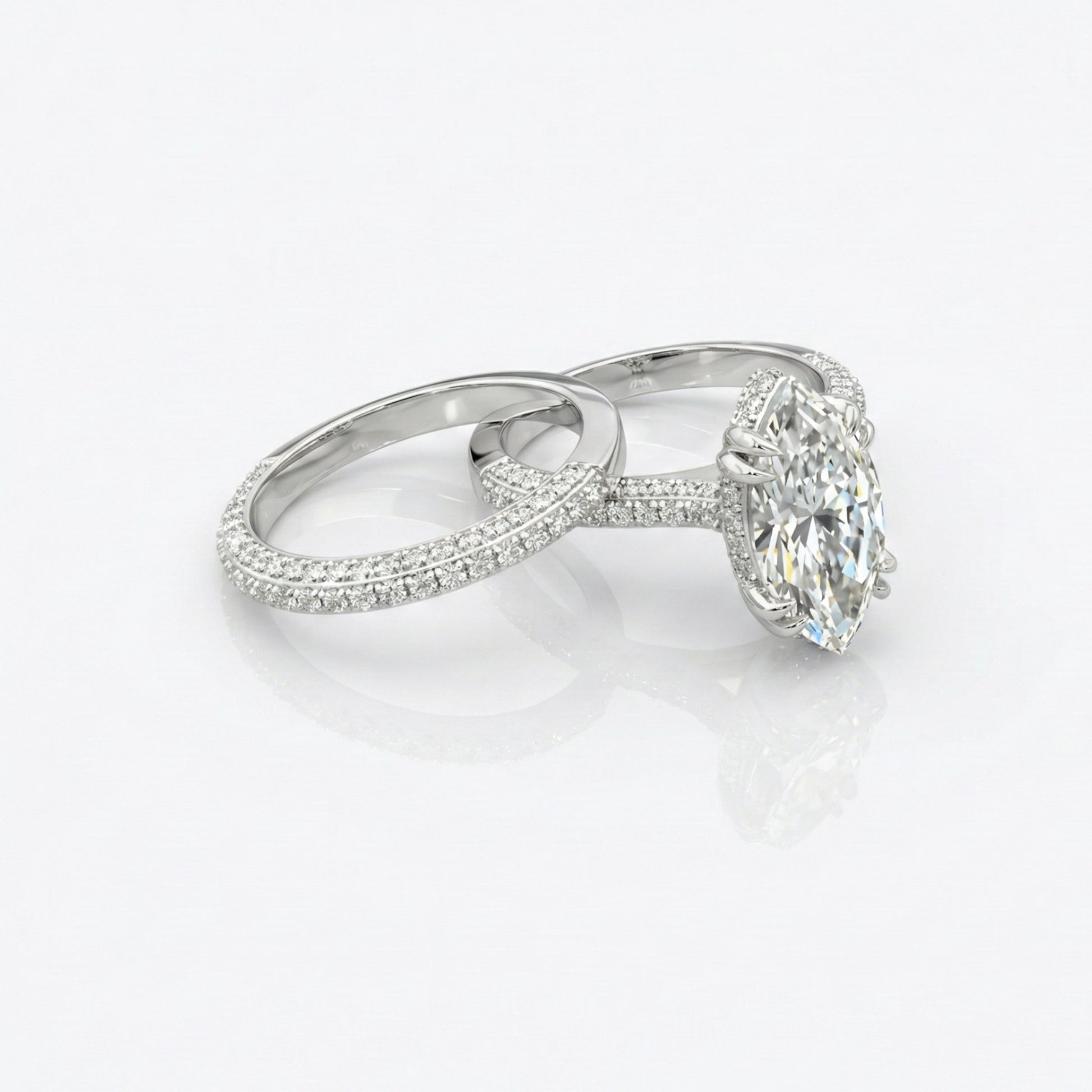 Diamond ring with a large central gemstone and smaller stones on a white background