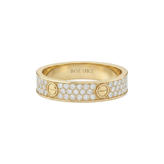 Gold ring with diamond accents on a white background