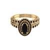 Gold ring with black gemstone on a white background
