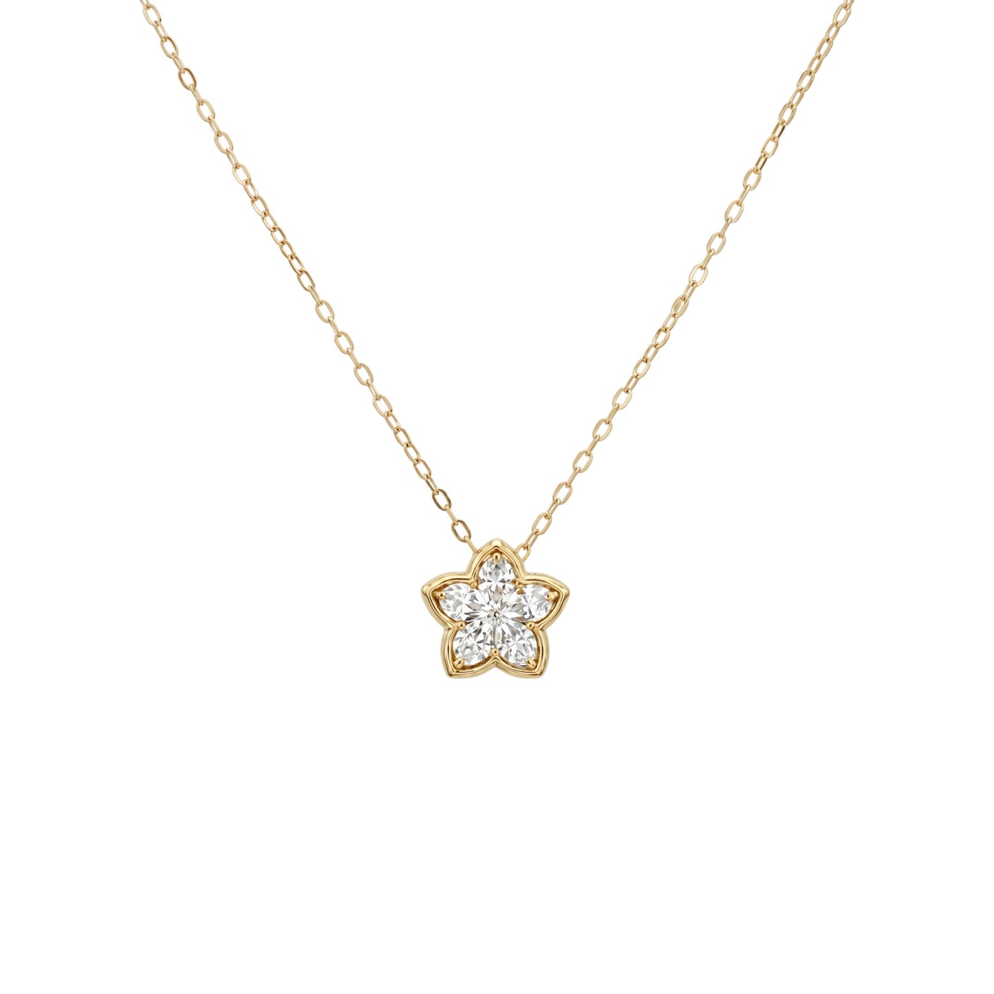Gold necklace with a star-shaped diamond pendant on a white background