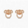 Rose gold butterfly-shaped earrings with clear gemstones on a white background