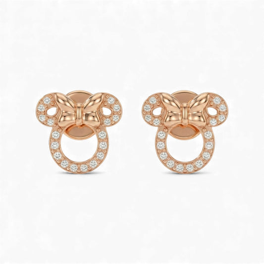 Rose gold butterfly-shaped earrings with clear gemstones on a white background