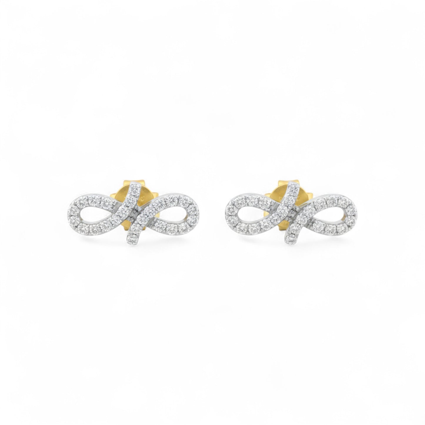 Pair of gold and silver infinity symbol earrings on a white background