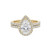 Ola Pear Cut Moissanite and natural diamond bridal set in 18KT gold ring with pavé diamond halo and matching band