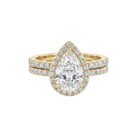 Ola Pear Cut Moissanite and natural diamond bridal set in 18KT gold ring with pavé diamond halo and matching band
