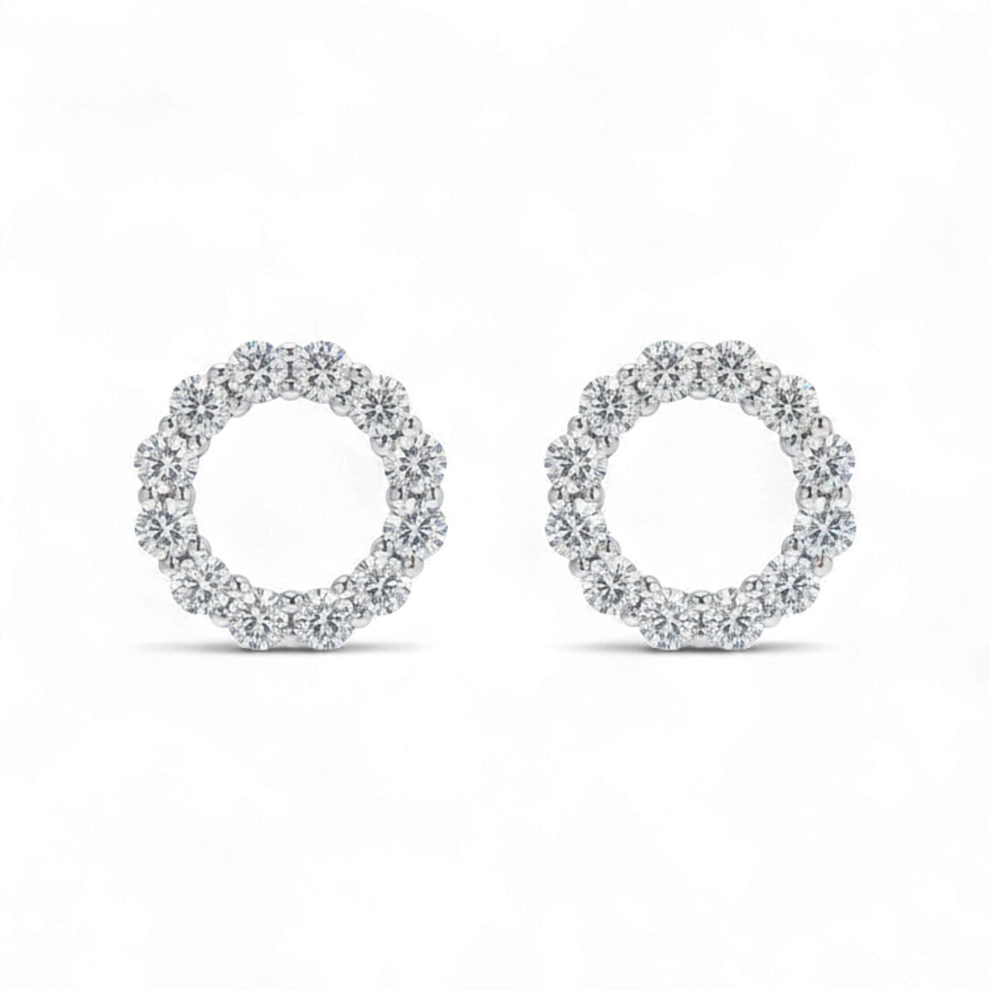 Pair of diamond earrings on a white background