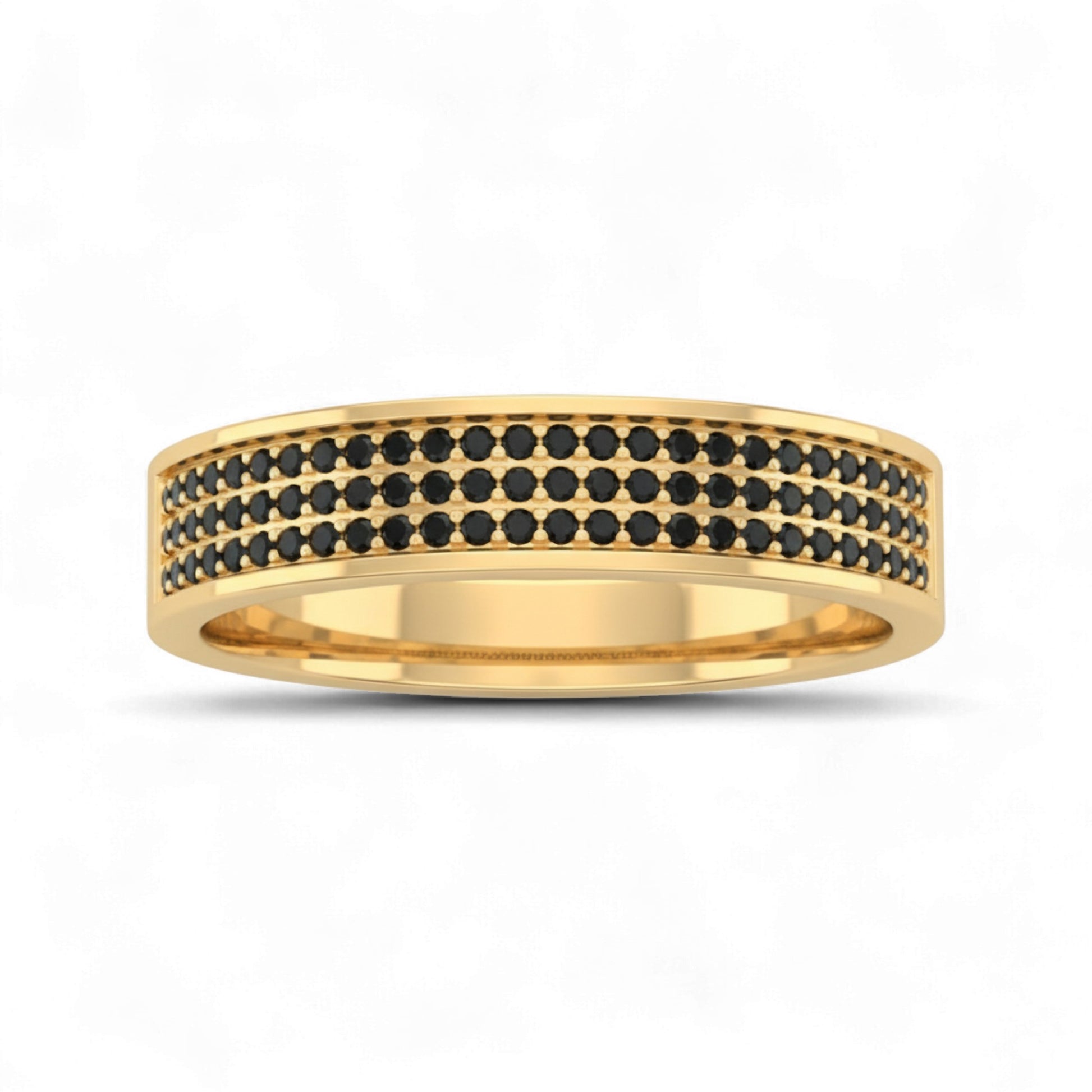 Gold ring with black gemstones on a white background
