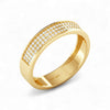 Gold ring with diamond accents on a white background