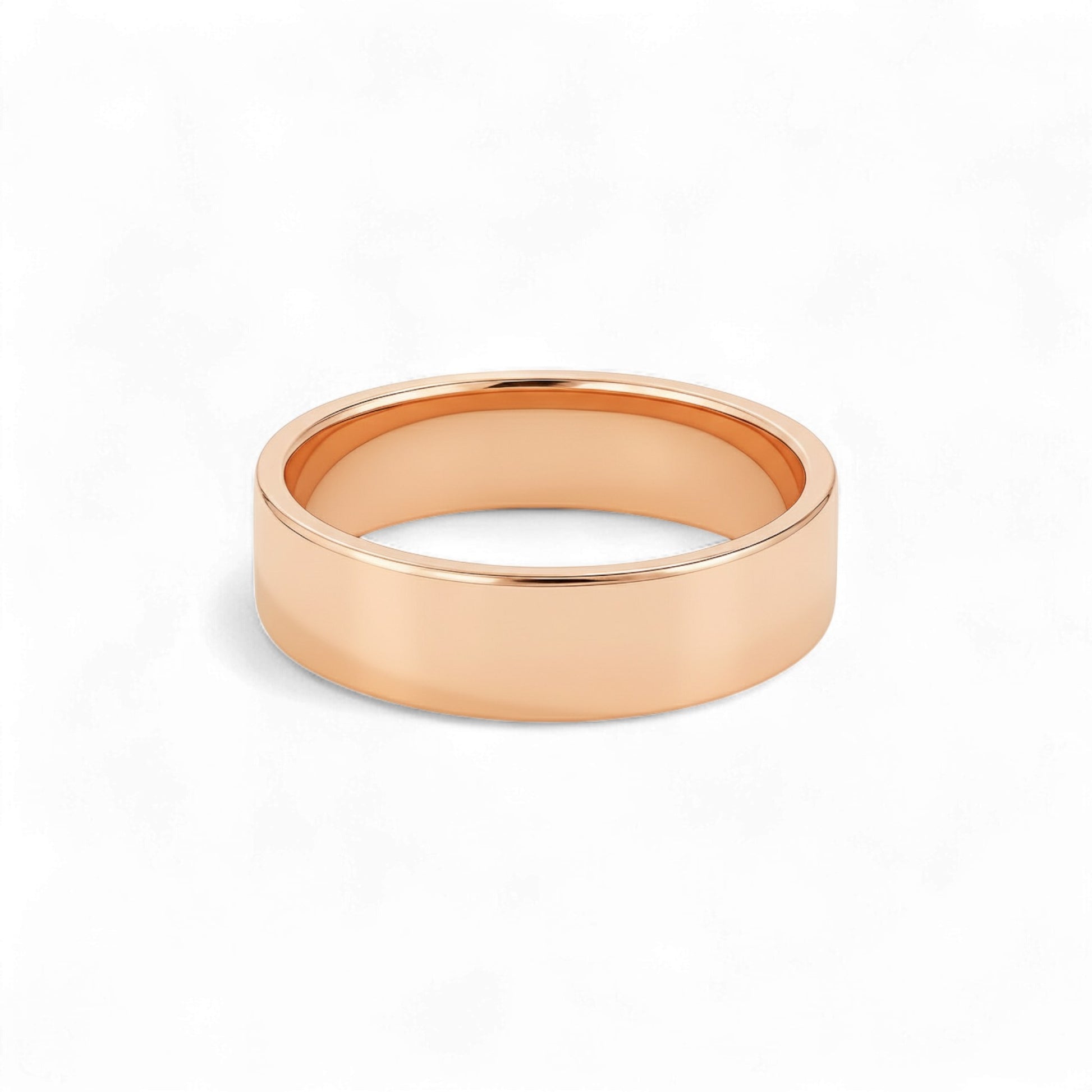 Rose gold ring on a white background